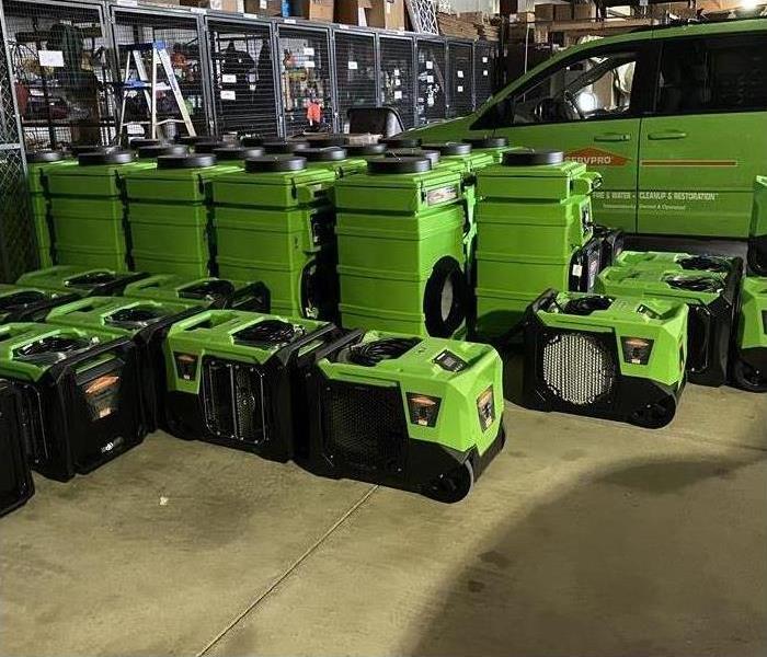 Air movers on a warehouse floor