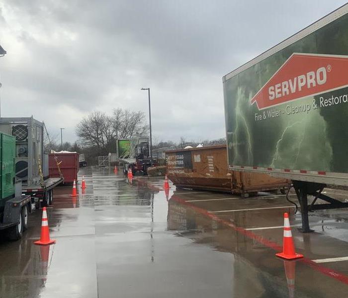 SERVPRO trucks at a commercial water damage job
